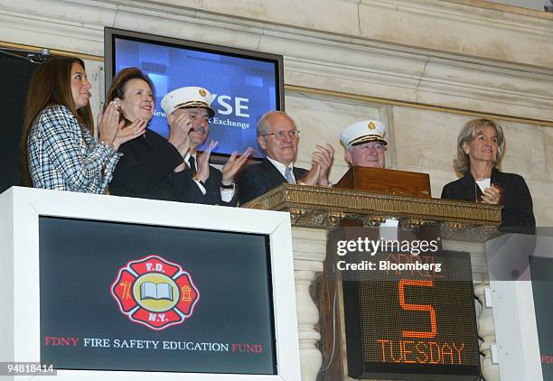 Catherine Kinney, President & Co-COO of the New York Stock Exchange, celebrates the opening bell ceremony with supporters of the New York Fire...