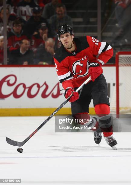 Ben Lovejoy of the New Jersey Devils plays the puck in Game Three of the Eastern Conference First Round against the Tampa Bay Lightning during the...