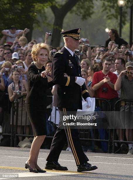 Former First Lady Nancy Reagan, wife of Former President Ronald Wilson Reagan, is escorted by Maj. Gen. Galan Jackman, Commander of the Military...