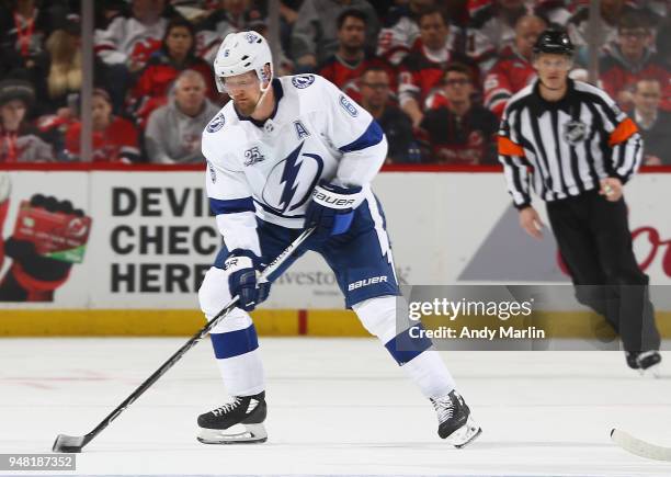 Anton Stralman of the Tampa Bay Lightning plays the puck in Game Three of the Eastern Conference First Round against the New Jersey Devils during the...