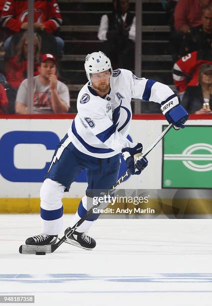 Anton Stralman of the Tampa Bay Lightning plays the puck in Game Three of the Eastern Conference First Round against the New Jersey Devils during the...