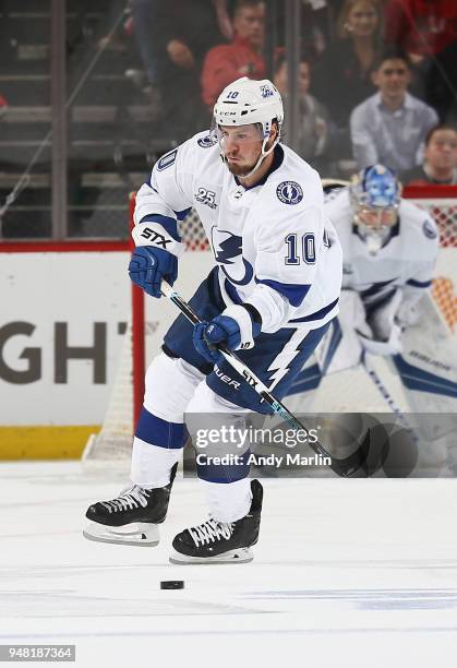 Jimmy Hayes of the Tampa Bay Lightning plays the puck in Game Three of the Eastern Conference First Round against the New Jersey Devils during the...