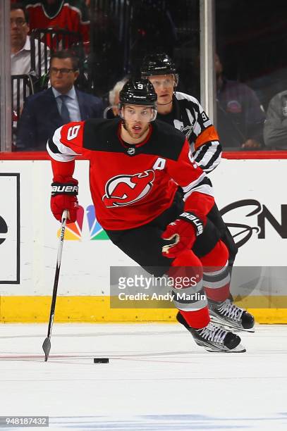Taylor Hall of the New Jersey Devils plays the puck in Game Three of the Eastern Conference First Round against the Tampa Bay Lightning during the...