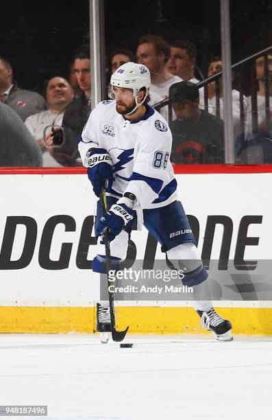 Nikita Kucherov of the Tampa Bay Lightning plays the puck in Game Three of the Eastern Conference First Round against the New Jersey Devils during...