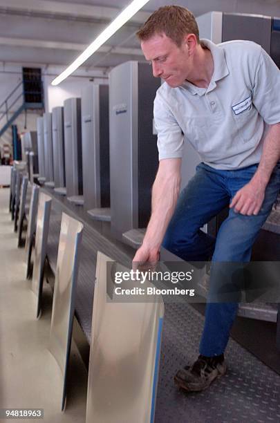 Frotscher Druckerei employee Stefan Hotz replaces a printing plate in a new Heidelberg Speedmaster printing press in Darmstadt, Germany, Monday,...