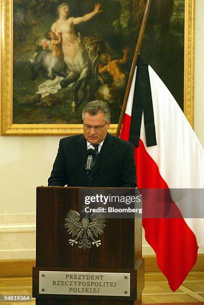 Polish President Aleksander Kwasniewski speaks in the Presidential Palace as the Polish flag flies at half mast after the death of the Pope, in...