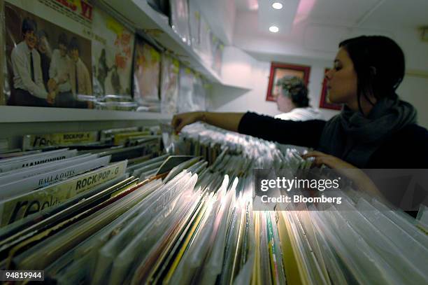 Customers browse through vinyl record albums at Reckless Records, on Berwick Street in Central London, Wednesday, January 18, 2006. Vivendi Universal...