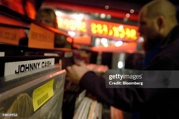 Customers browse through vinyl record albums at Reckless Records, on Berwick Street in Central London, Wednesday, January 18, 2006. Vivendi Universal...