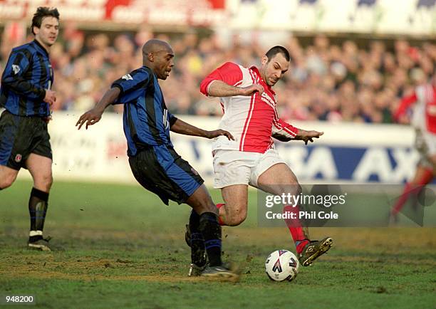 Richard Rufus of Charlton Athletic is challenged by Danny Shipp of Dagenham and Redbridge during the FA Cup Third Round Replay at the Victoria Ground...