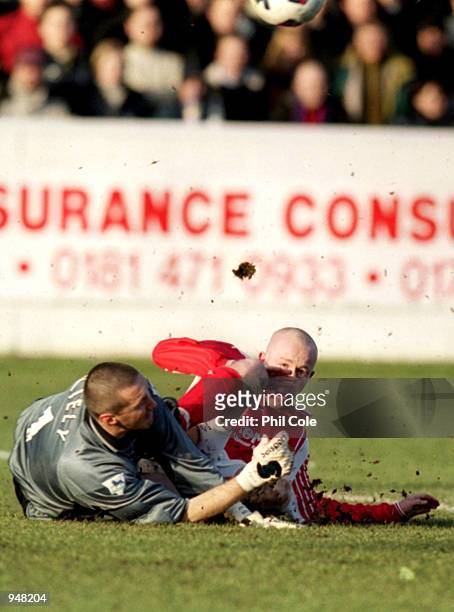 Charlton Athletic keeper Dean Kiely is challenged by Paul Terry of Dagenham and Redbridge during the FA Cup Third Round Replay at the Victoria Ground...