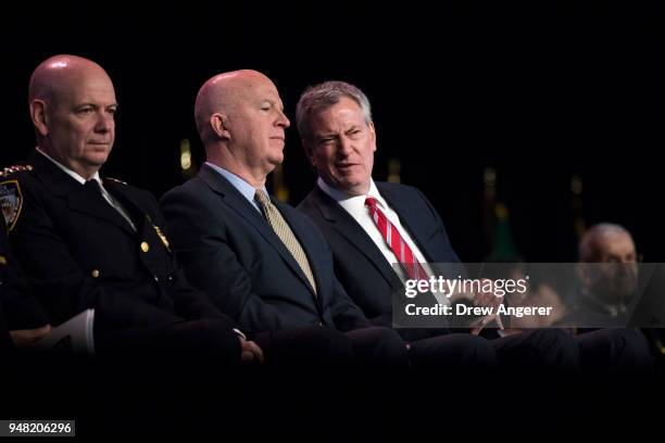 New York City Police Commissioner James O'Neill talks with New York City Mayor Bill de Blasio during a police academy graduation ceremony at the...