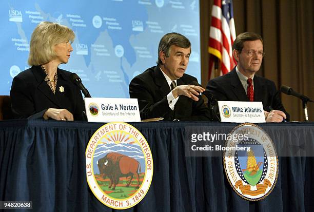 Gale Norton, Secretary of The Interior, left, and Mike Leavitt, Secretary of Health and Human Resources, right, listen to Mike Johanns, Secretary of...