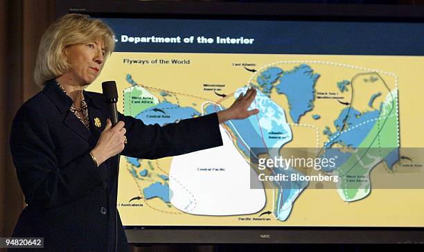 Secretary of The Interior Gale Norton shows the flight path of migratory birds during a news briefing in Washington, D.C., March 20 on the combined...