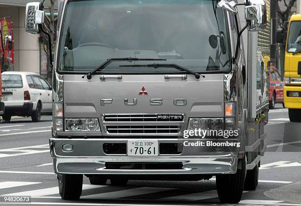 Mitsubishi Fuso Fighter truck is pictured driving in Tokyo Tuesday, March 29, 2005. Mitsubishi Fuso Truck & Bus Corp., DaimlerChrysler AG's Japanese...