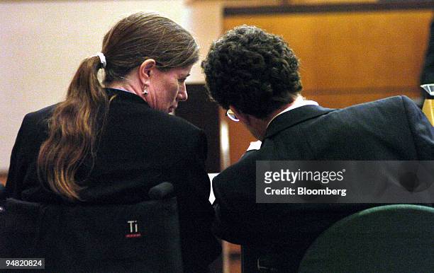 Benetta Buell-Wilson confers with her husband Barry in San Diego Superior courtroom on Thursday, June 3, 2004 in California. Ford Motor Co., the...