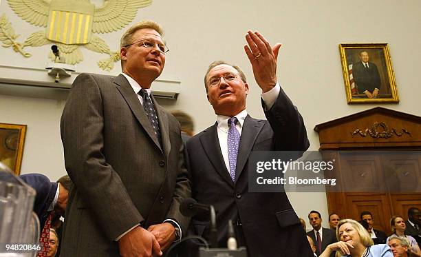 Jeff Potter, CEO, Frontier Airlines, left, speaks with Glenn Tilton, CEO, United Airlines, before a Subcommittee on Aviation hearing in Washington DC...