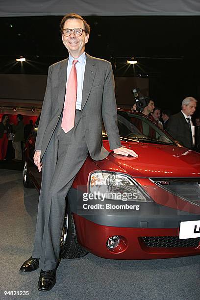 Renault chief executive Louis Schweitzer poses with the Renault-Dacia X90 in Guyancourt, near Paris, France, Wednesday, June 2, 2004. France's...