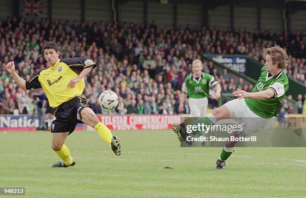 Warren Patmore of Yeovil Town has his shot blocked by Tarkan Mustafa of Rushden & Diamonds during the Nationwide Football Conference match played at...