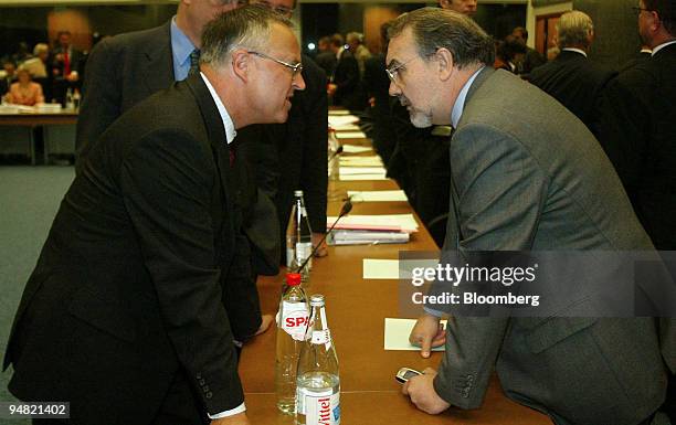 Hans Eichel, German finance minister, left, speaks to Pedro Solbes Mira, Spainish economy minister speak prior to the European finance ministers...