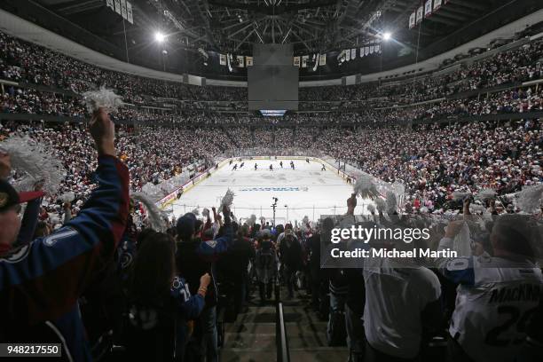 Fans wave pom poms prior to the start of Game Three of the Western Conference First Round during the 2018 NHL Stanley Cup Playoffs between the...