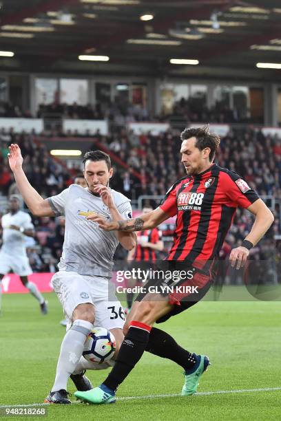 Manchester United's Italian defender Matteo Darmian vies with Bournemouth's English midfielder Charlie Daniels during the English Premier League...