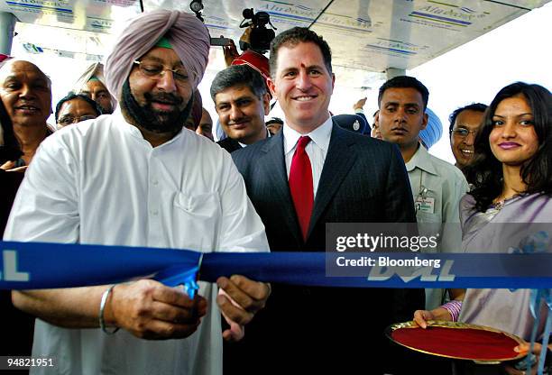 Dell Inc. Founder Michael Dell, center, wearing a traditional Hindu tilak, smiles as Punjab State Chief Minister Amarinder Singh, left, inaugurates...