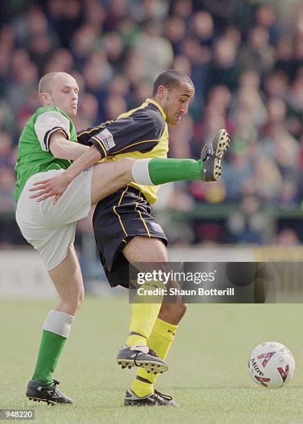 Justin Jackson of Rushden & Diamonds holds the ball up against David Piper of Yeovil Town during the Nationwide Football Conference match played at...