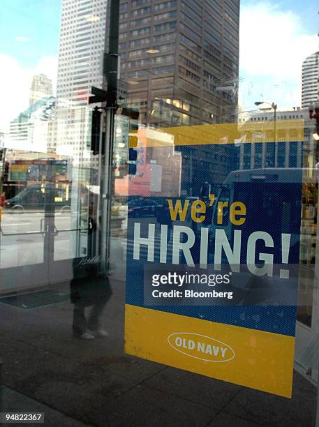 Sign is pictured on the door of an Old Navy store on State Street in Chicago, Illinois advertises, "we're HIRING!" on Friday, March 10, 2006....