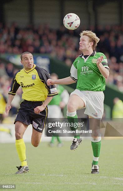 Terry Skiverton of Yeovil Town takes the ball past Justin Jackson of Rushden & Diamonds during the Nationwide Football Conference match played at...