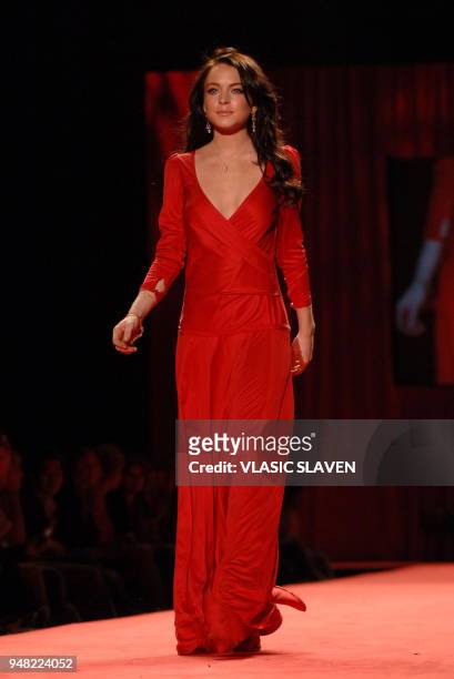 New York, NY - FEB. 3, 2006: Actress Lindsay Lohan walks the runway at the Heart Truth's Red Dress show during the Fall/Winter 2006 Olympus Fashion...