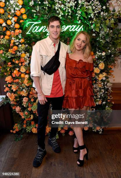 Isaac Carew and Tess Ward attend the launch of new gin Tanqueray Flor de Sevilla in partnership with Jose Pizarro at Pizarro Restaurant on April 18,...