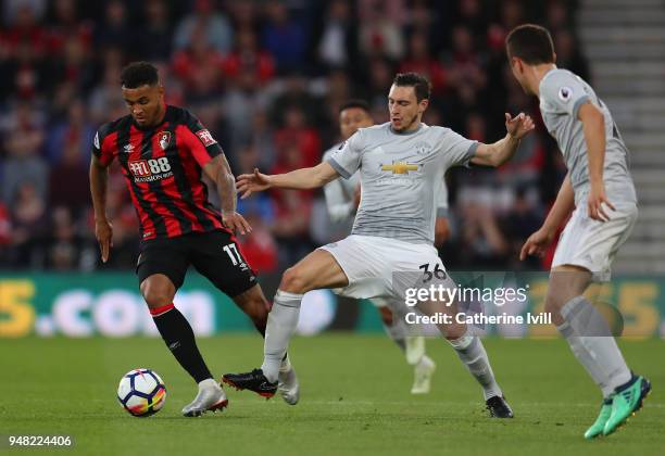 Joshua King of AFC Bournemouth and Matteo Darmian of Manchester United battle for possession during the Premier League match between AFC Bournemouth...