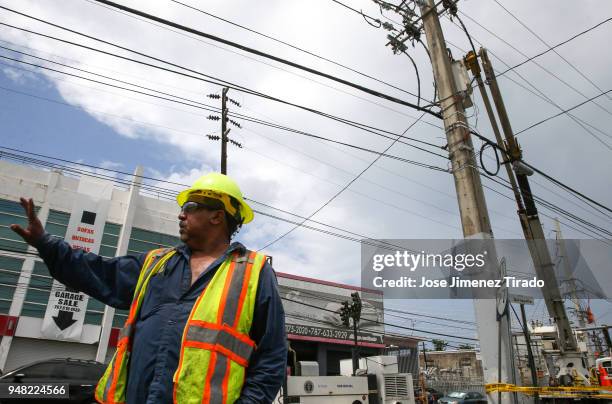 Victor Vazquez, employee of the Puerto Rico Electric Power Authority , during repair work on power lines affected by Hurricane Maria April 18, 2018...