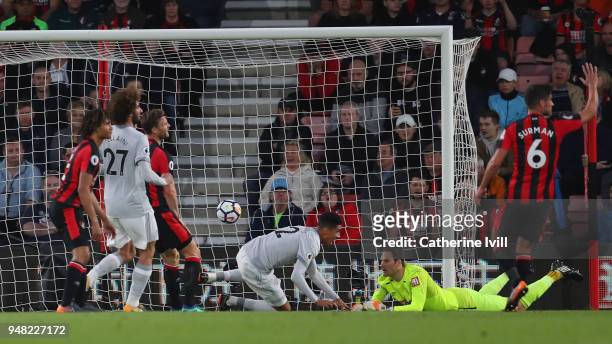 Chris Smalling of Manchester United scores his sides first goal during past Asmir Begovic of AFC Bournemouth the Premier League match between AFC...