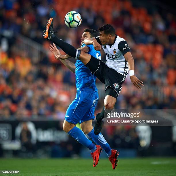 Jeison Murillo of Valencia competes for the ball with Jorge Molina of Getafe during the La Liga match between Valencia and Getafe at Mestalla Stadium...