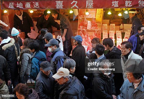 Year-end shoppers walk in a street in Ameyoko market, Tokyo, Japan, Wednesday, December 28, 2005. Japan's retail sales fell in November, the third...