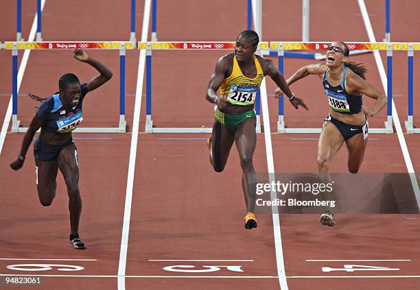 Dawn Harper of the U.S., left, nears the finish line alongside Delloreen Ennis-London of Jamaica, center, and Lolo Jones of the U.S., during the...