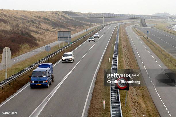 Road runs parallel to a sand dune dike in Zeeland, The Netherlands,Tuesday, January 10, 2006.