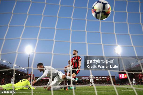 Chris Smalling of Manchester United scores his sides first goal past Asmir Begovic of AFC Bournemouth during the Premier League match between AFC...