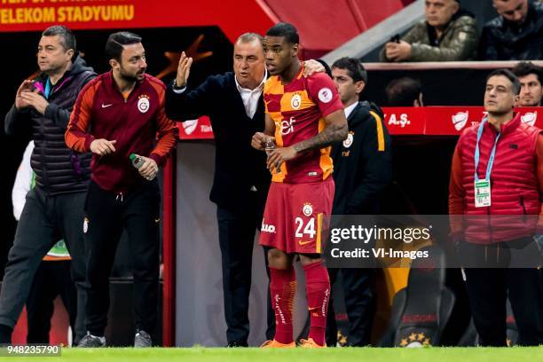 Garry Mendes Rodrigues of Galatasaray SK gets instructions from coach Fatih Terim of Galatasaray SK during the Ziraat Turkish Cup match Fenerbahce AS...