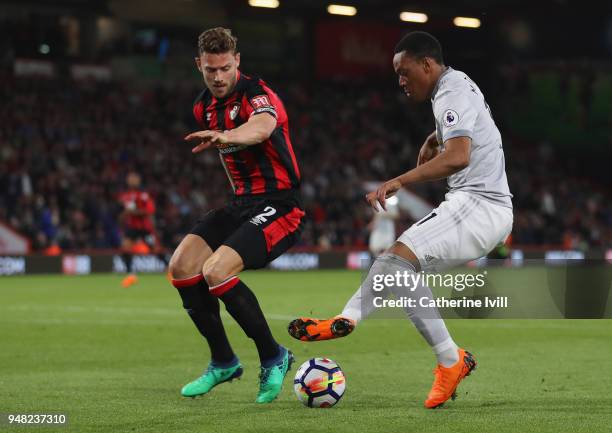 Simon Francis of AFC Bournemouth and Anthony Martial of Manchester United battle for possession during the Premier League match between AFC...