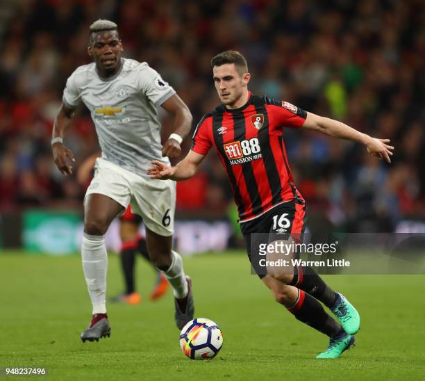 Paul Pogba of Manchester United and Lewis Cook of AFC Bournemouth battle for possession during the Premier League match between AFC Bournemouth and...