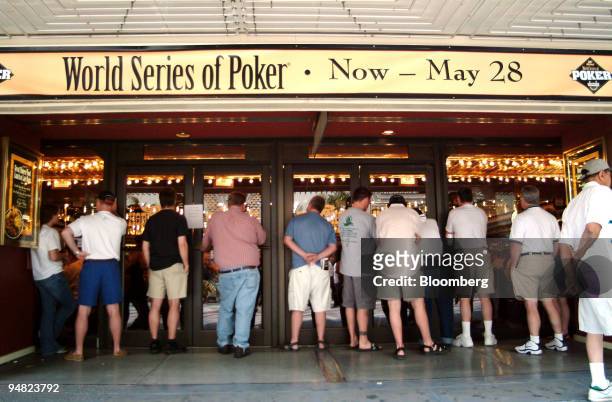 Unable to garner a spot in the capacity crowd inside, poker fans look on from outside during the World Series of Poker at Binion's Horseshoe Hotel &...