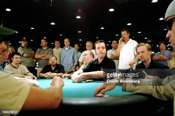 Dealer, center in black shirt, begins his first shuffle as the World Series of Poker kicks off at Binion's Horseshoe Hotel & Casino in Las Vegas,...