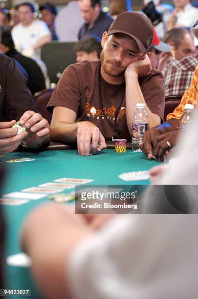 Actor Chris Masterson, who plays Francis on the Fox TV series "Malcolm in the Middle," looks on as the hand plays out during the World Series of...