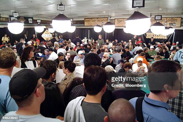 Part of a capacity crowd of spectators look on from behind the rails during the World Series of Poker at Binion's Horseshoe Hotel & Casino in Las...
