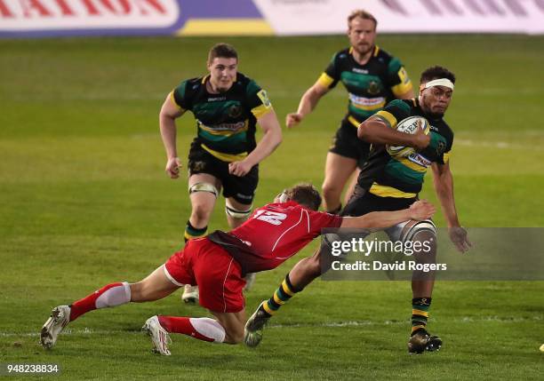 Devante Onojaife of Northampton is tackled by Lt Simpson during the Mobbs Memorial match between Northampton Saints and the British Army at...