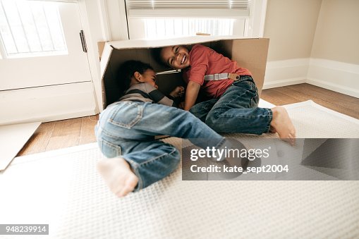 Hiding In Box Kids Hiding Inside A Box High-Res Stock Photo - Getty Images