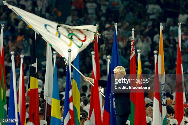 Boris Johnson, the mayor of London, waves the Olympic flag during the closing ceremony of the 2008 Beijing Olympics in Beijing, China, on Sunday,...
