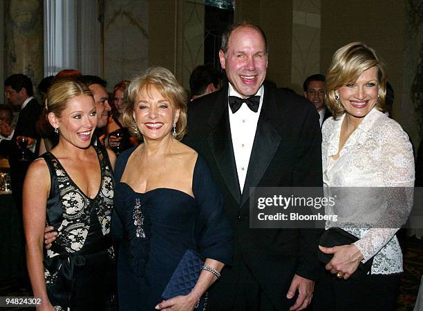 Michael Eisner CEO of Walt Disney Company, third from left is joined by television personalities Kelly Ripa, left, Barbara Walters, second from left,...